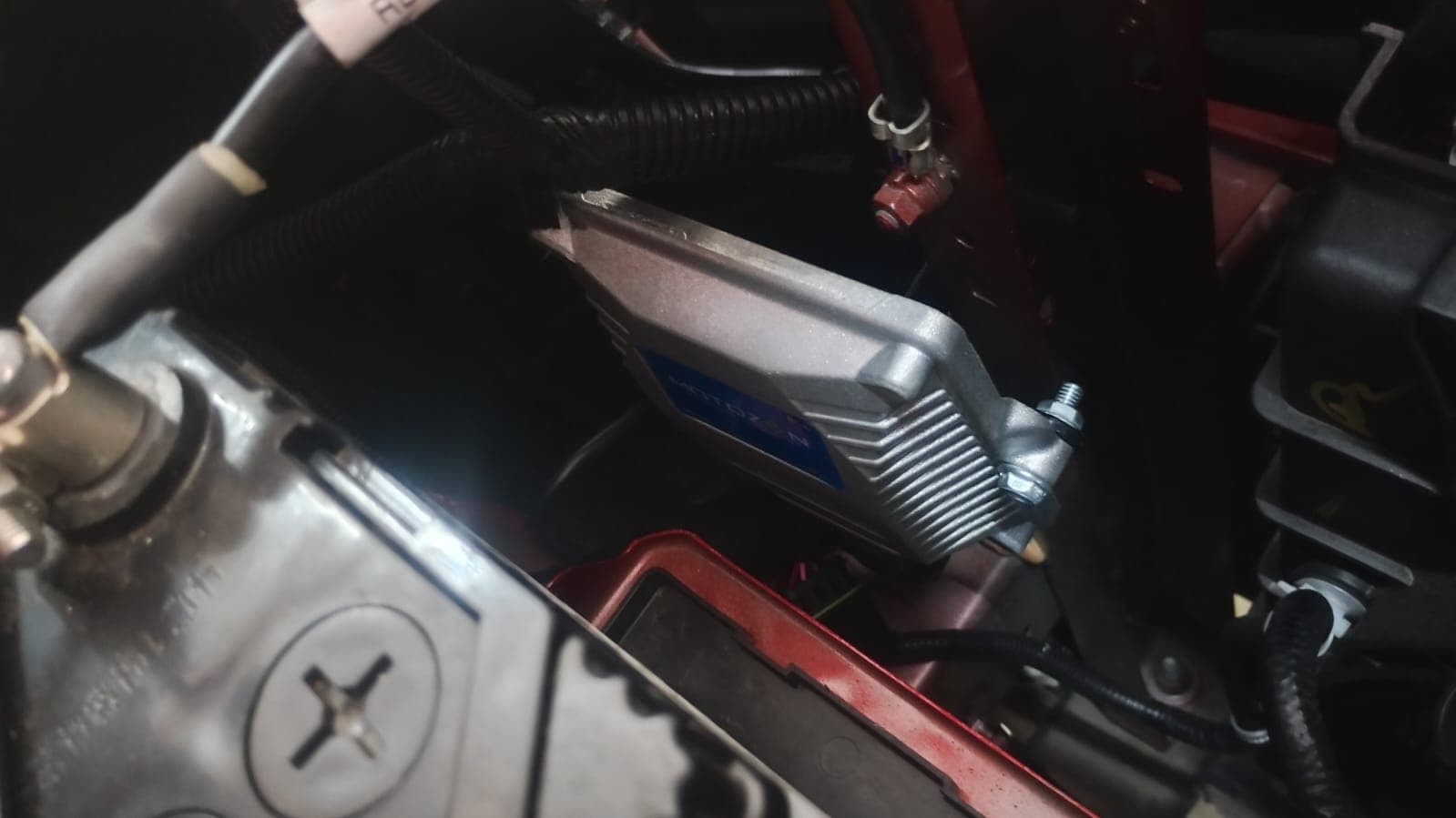 CNG ECU mounted beside the engine bay wiring
