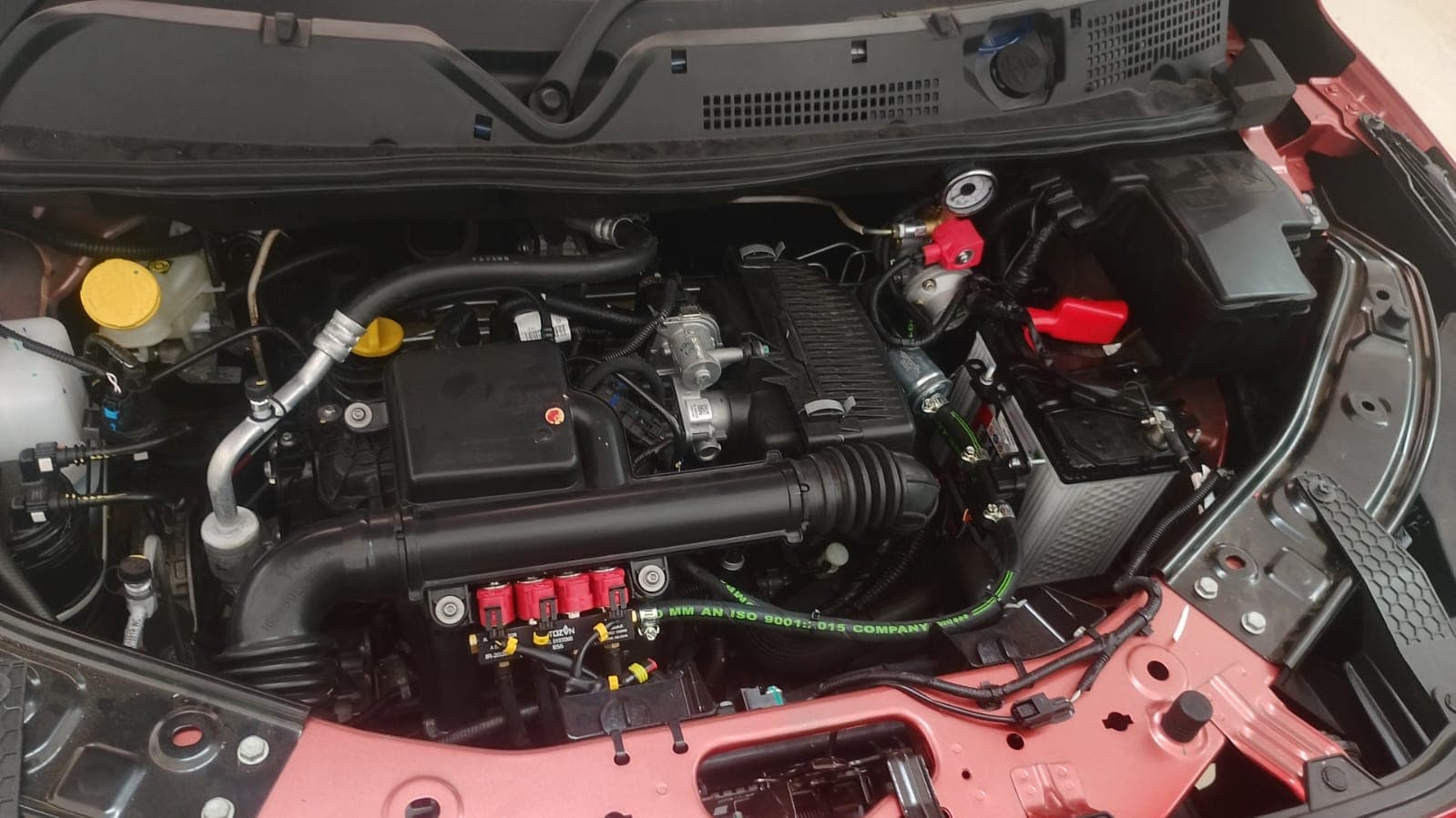 Engine bay with the CNG injector rail, regulator and gas lines fitted